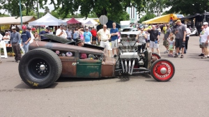 If you look closely you can see the super charger does not actually have a belt driving it, thus making the super charger non-functional. The rust finish and general cartoon-like appearance allude to the fact that this car is definitely a rat rod. - I love this car. It demands attention, which is the goal of a rat rod. 