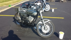 Yamaha Cafe racer. Notice the clip on handle bars. The seating position under the rider and the solo seat parallel to the ground. 